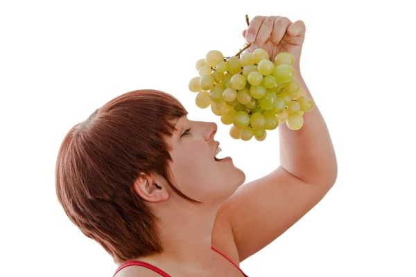 Woman eating grapes — Stock Photo, Image