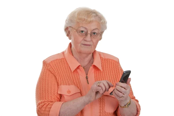 Бабушка пишет смс — стоковое фото