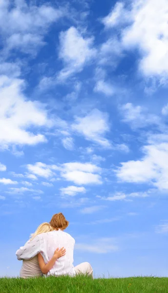 stock image Guy and girl sitting on a lawn