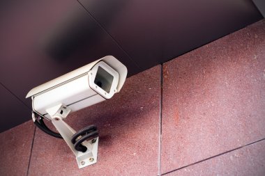 Security camera on office building clipart