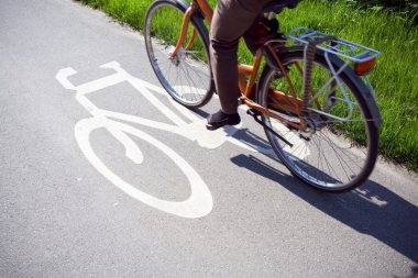 Woman cycling to work clipart