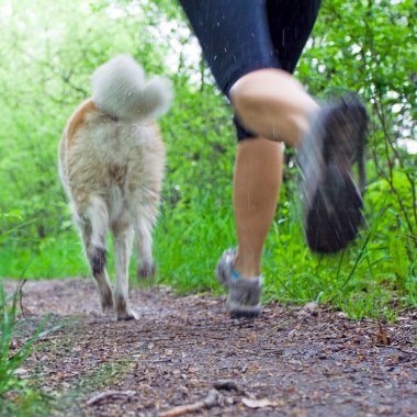 Woman running in forest, motion blur clipart