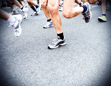 Marathon runners, running motion blur in city clipart