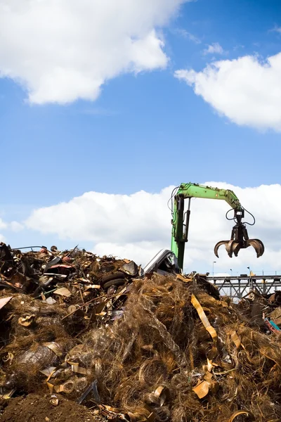 Metal recycling over blue sky — Stock Photo, Image