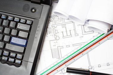 Laptop and architect blueprints clipart