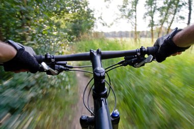 Riding mountain bike in summer clipart