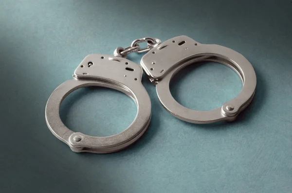 Pair of police handcuffs — Stock Photo, Image