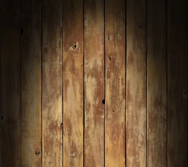 劇的に点灯している苦しめられた木製の表面 — ストック写真
