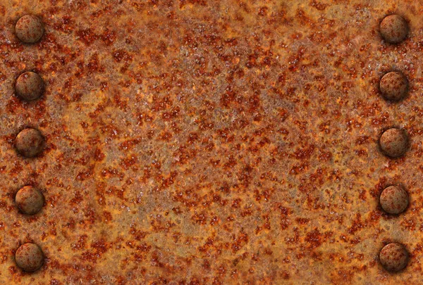Rusted metal surface with rivets — Stock Photo, Image