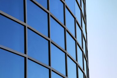 Curved exterior windows of a modern commercial office building clipart