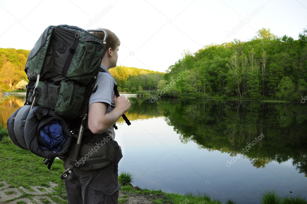 Teenage hiker standing by Sunrise Lake