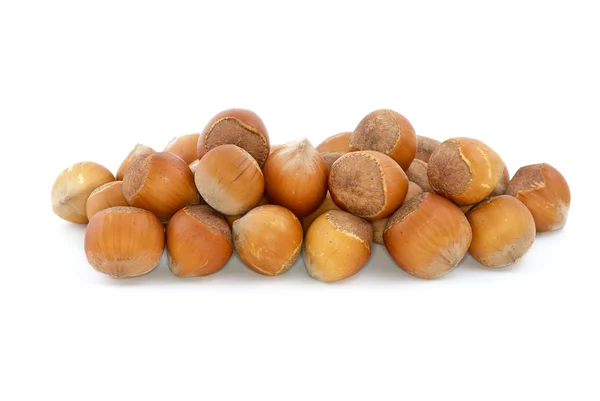 Malé hromádky lískových ořechů — Stock fotografie