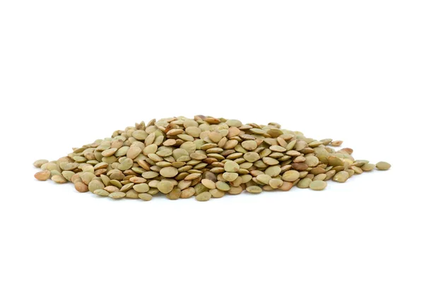 Pequena pilha de sementes de lentilha secas — Fotografia de Stock