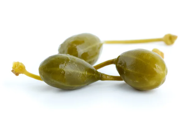 Macro shot of three capers fruits — Stock Photo, Image