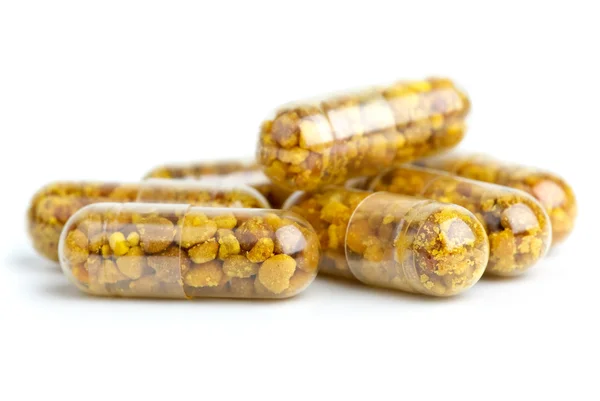 Algumas pílulas homeopáticas com pólen — Fotografia de Stock