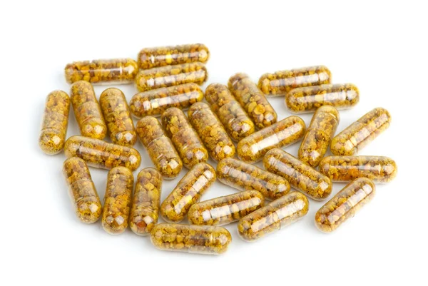 Montón de píldoras homeopáticas con polen — Foto de Stock
