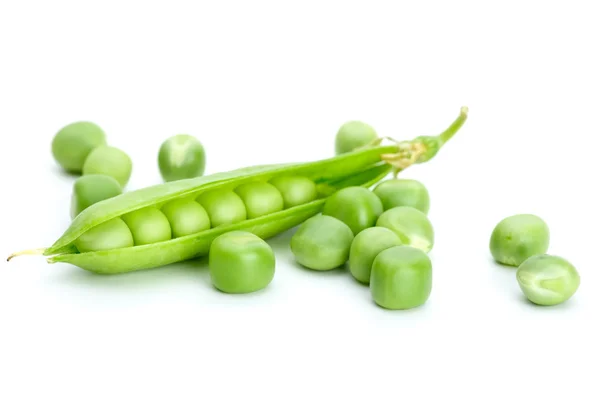Peas and cracked pod — Stock Photo, Image
