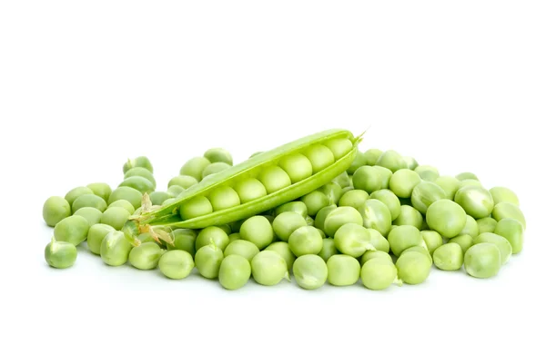 Cracked pod over pile of green peas — Stock Photo, Image