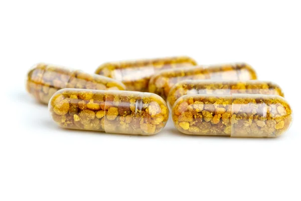 Algunas pastillas homeopáticas con polen de abeja — Foto de Stock