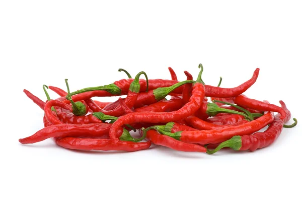 Hromadu dlouhou zakřivenou red hot chili papričky — Stock fotografie