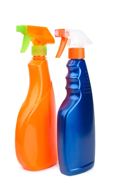 Oranžový a modrý postřikovač láhve — Stock fotografie