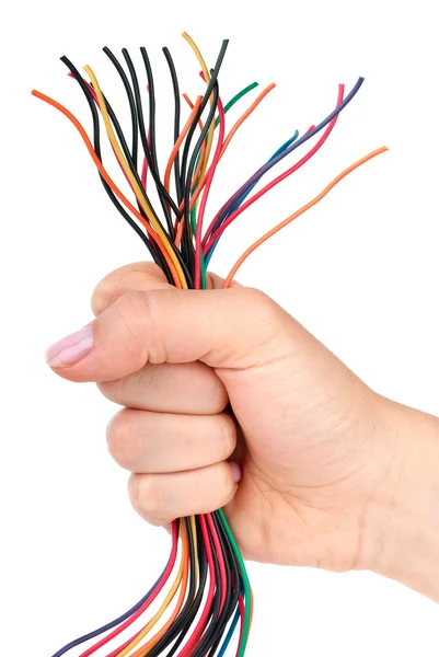Bunch of different colored wires gripped in fist — Stock Photo, Image
