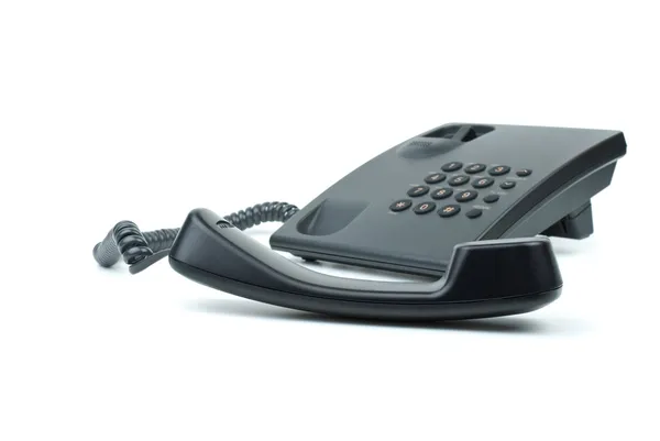 Чорний офісний телефон з клавіатурою на передньому плані — стокове фото