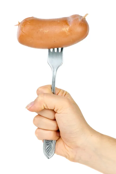 Salsicha à mão no garfo. Isolado no fundo branco — Fotografia de Stock