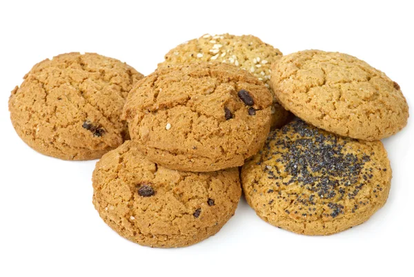 stock image Few oatmeal cookies (with raisins, sesame and poppy seeds) isolated on the