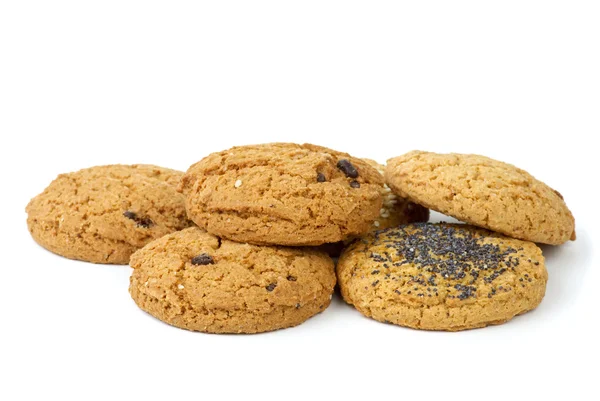 stock image Few oatmeal cookies (with raisins, sesame and poppy seeds) isolated on the