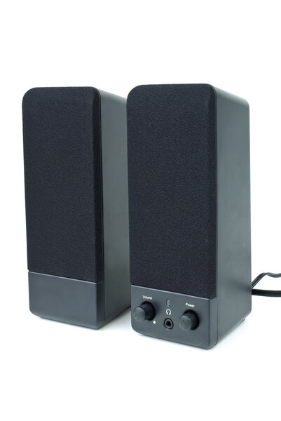 Cheap black computer speakers isolated on the white background