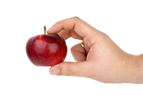빨간 사과 복용 하는 손 — 스톡 사진