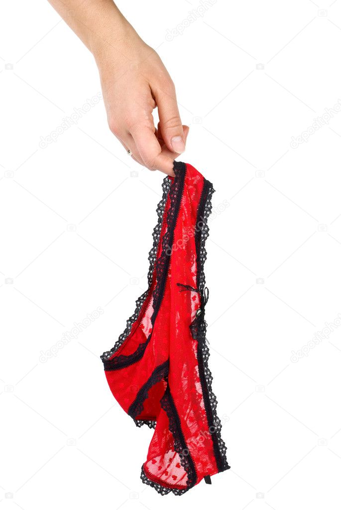 Sexy women's red lace panties hanging on the finger