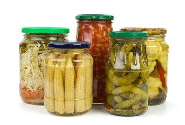 Glass jars with marinated vegetables clipart