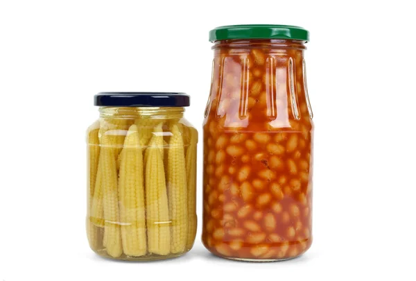 Glass jars with marinated corn ears and harricot beans — Stock Photo, Image