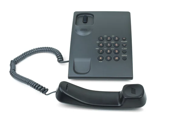 Black phone with handset near — Stock Photo, Image