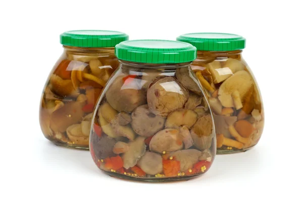 Glass jars with marinated mushrooms — Stock Photo, Image