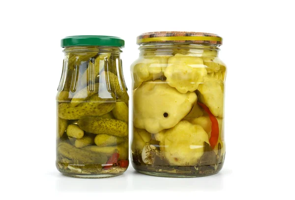 Glass jars with cornichons and cymblings — Stock Photo, Image