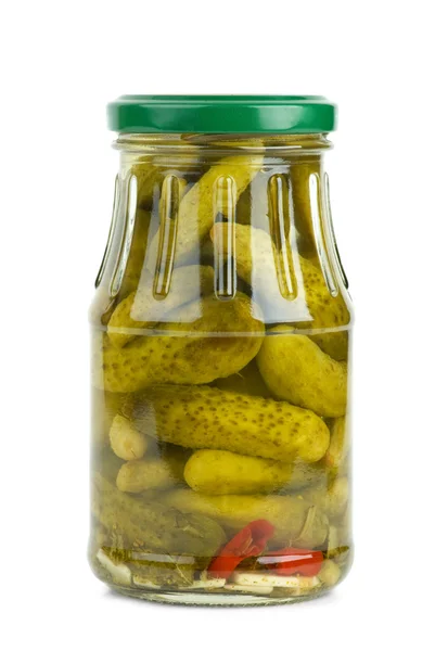 Glass jar with marinated cornichons Royalty Free Stock Photos