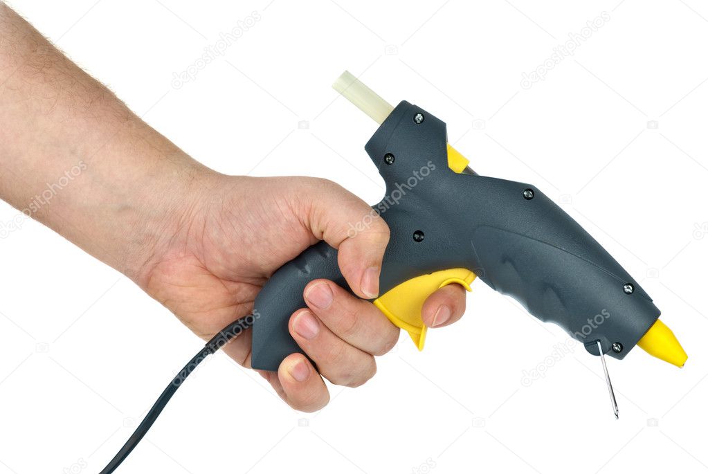 Hand holding glue gun