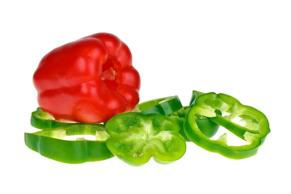 Röd paprika och skivad grön — Stockfoto