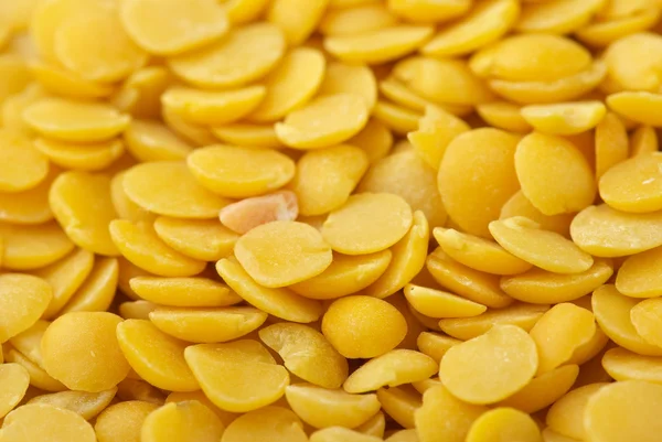 Yellow split lentils closeup — Stock Photo, Image
