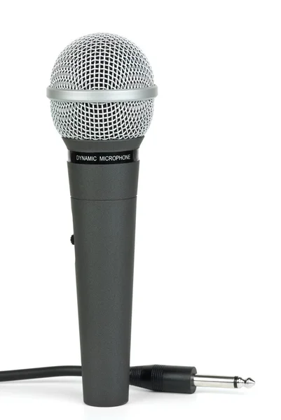 Microfone dinâmico profissional e cabo com jack perto — Fotografia de Stock