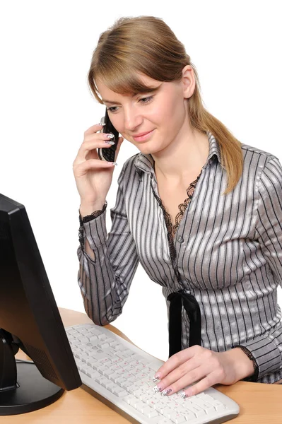 Woman in front of her desktop computer — Stock Photo, Image