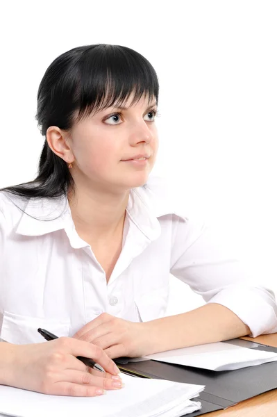 Woman sits at a table — Stock Photo, Image