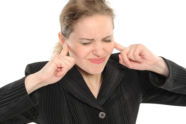 Mulher com os dedos a tapar os ouvidos — Fotografia de Stock