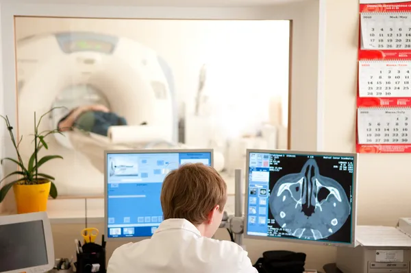 Doctor with CT scan films — Stock Photo, Image