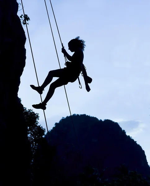 Climbing woman silhouette
