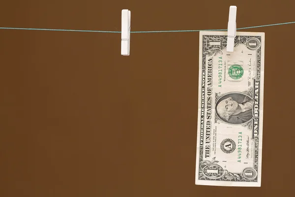 One Dollar hanging on clothesline — Stock Photo, Image