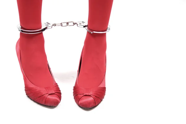 Women legs in handcuffs — Stock Photo, Image